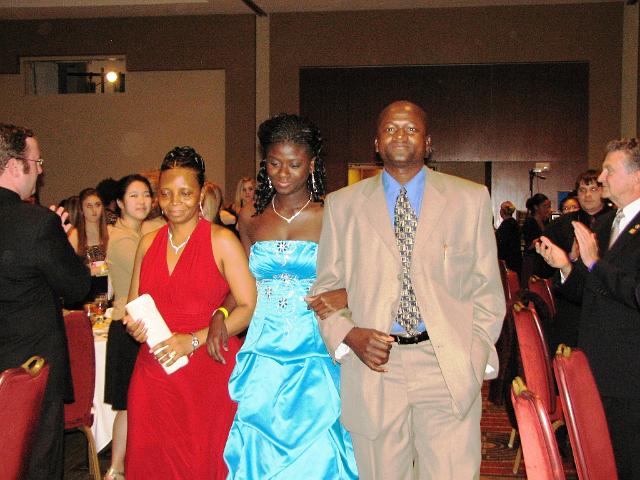 IMG_6739.JPG - A very proud moment:  Capital District Key Club Governor Samah McGona is escorted by her proud parents in the presentation of the Governor to the cheers of the K-Family.  Terrific!