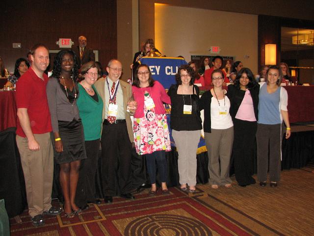 IMG_6901.JPG - Bill is surrounded by his close friends a the podium and by all those who take pride in what he, with Janet at his side have done for Key Club over many years.  You can see that praise, recognition and thanks in their faces. We all say “Thanks, Bill, well done.  You are loved in this Capital District”.