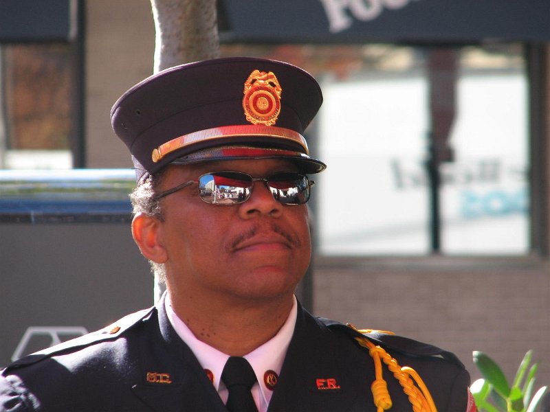 IMG_0016.JPG - The National Anthem was then sung proudly and firmly by Scott Forbes of the Montgomery County Fire and Rescue Service. The Pledge of Allegiance was lead by Bob Waters, American Legion Post #105 Commander who then proceeded with Half Staffing of the Flag while the attendees remained standing and silent, with veterans saluting.