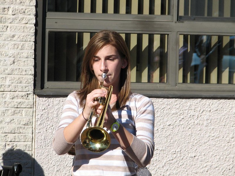 IMG_0023.JPG - Amy Lipman, Senior at Bethesda-Chevy Chase High School and a member of the Brass Ensemble trumpets TAPS as the ceremony begins to close.