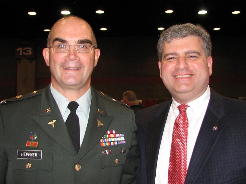 IMG_3719.JPG - COL Gray Heppner receives the thanks and congratulations of our new KI President Paul Palozzola.  The award comes with a $10,000 grant from our Kiwanis International Foundation which Gray will put toward his research.  The world wide recognition helps to bring attention to this #1 killer of children in Africa.  COL Gray was sponsored by the Kiwanis Club of Lynchburg and his brother, District Trustee David Heppner, Southwest Region.  Please see the complete story elsewhere in this issue of the eBuilder.