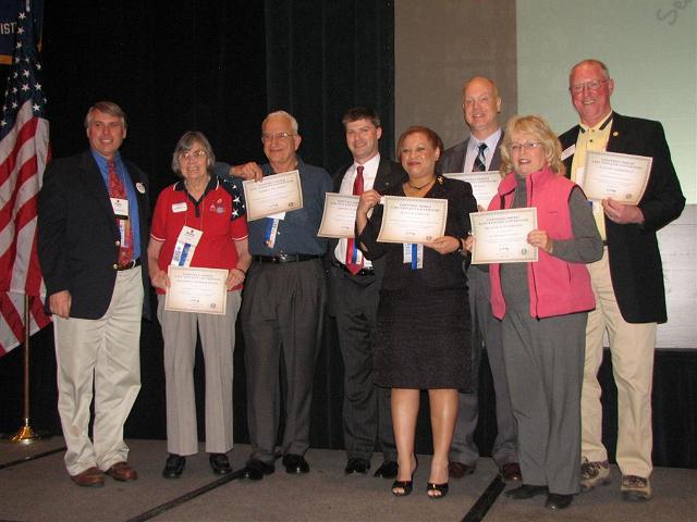 IMG_6443.JPG - Immediate Past Governor Tom Ganse took great pride in presenting the 2008-2009 Distinguished Lieutenant Governor Awards to (from the left) Millie Krimelmeyer (Division 22), Jim Gilchrist (5), Jeffery Wolff (20), Elana Gardiner (1), Allan Kujula (11), Judy Pantelides (13) and Scott Zimmerman (23).  That’s exciting!