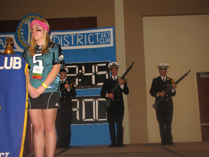 IMG_0690.JPG - Governor Rachael remains very, very still as the Navy Junior ROTC rifle drill team does manual of arms behind her.  Good Job … both of you.