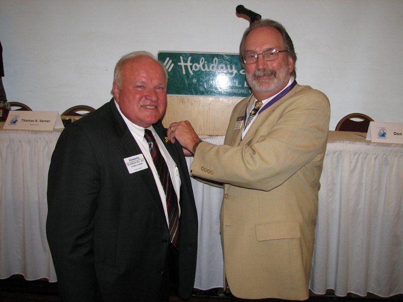 IMG_2044.JPG - KI Trustee Dr. Button (right) presents Gov. Desig. Tom Varner with his Govern's pin.