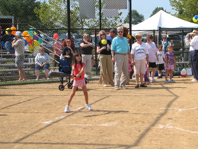 IMG_8883.JPG - Home Plate.  This field is still a regular field with the ‘offense’ being the kids we are there to help. The ‘defense’ was the real Bethesda Chevy Chase “Red Sox” high school baseball team who volunteered to help “their community one child at a time”.  Children who needed coaches or help batting or running the bases was provided by Kiwanians and other volunteers.  She’s “Batter UP”!