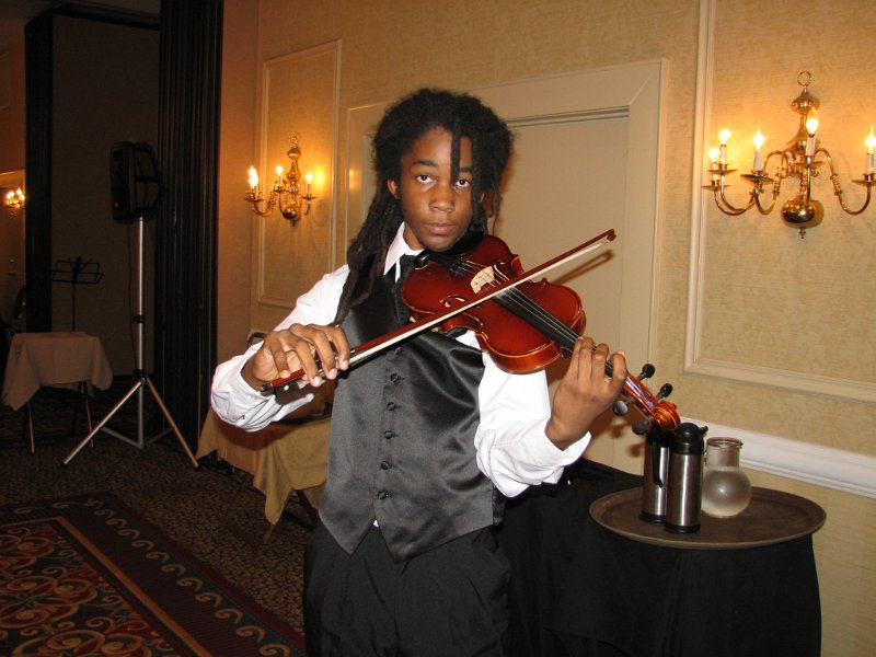 137.JPG - The Strolling Silver Strings provided classy and classic entertainment during our banquet as they indeed did stroll through the seating arrangement. Their elegant formal dress and radiant smiles brought a wonderfully relaxed mood to the affair. They are presented through the Music Education and Programs for the Gifted of the Norfolk Public Schools.